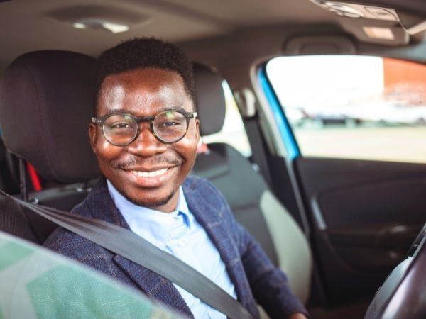 Man Driving a Blue Car