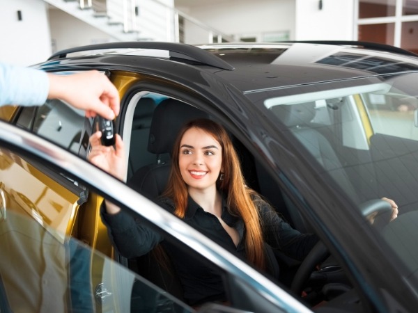 Woman Receiving a Car Key