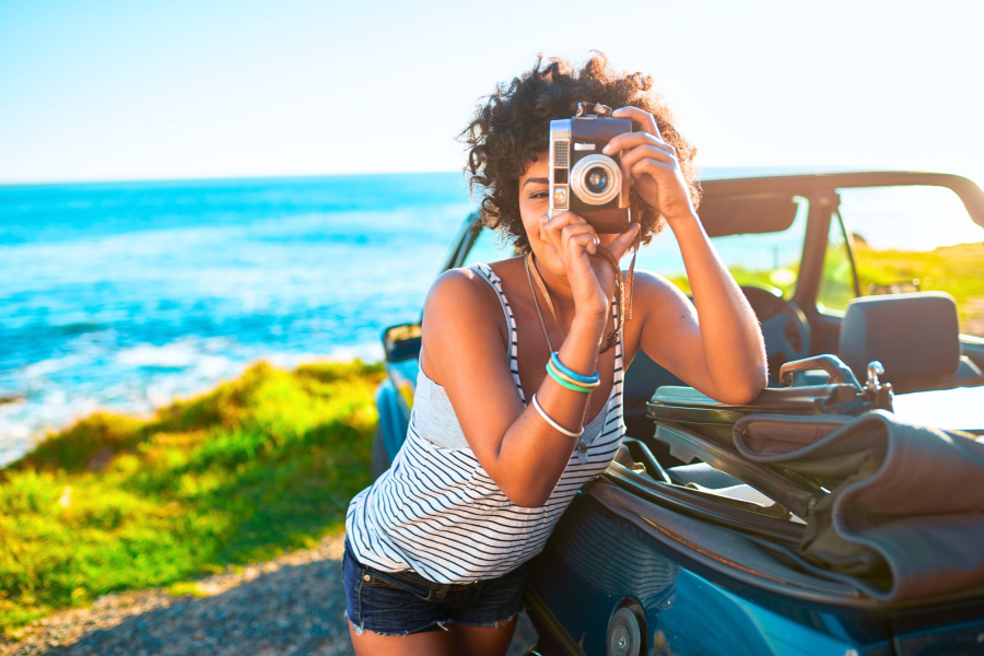 Woman with a Camera on the Beach