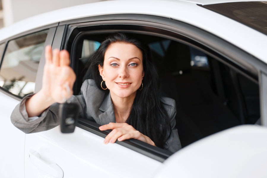 Woman Driving a White Car