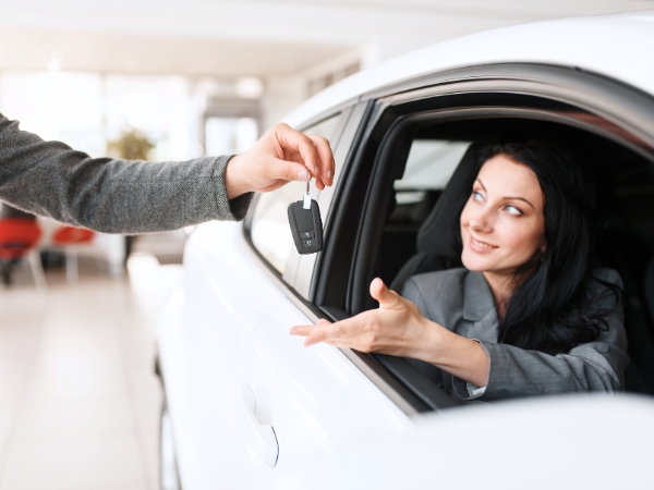Woman Driving a White Car