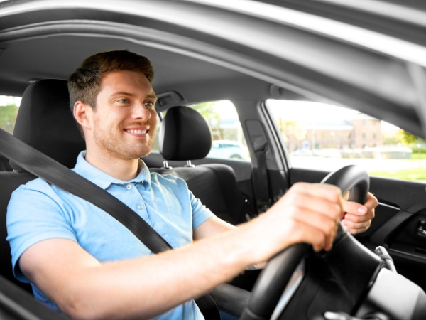Man Driving a White Car
